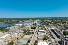An aerial photograph of De Pere, Wisconsin. De Pere, Wisconsin is a location served by Rosenow Customs.