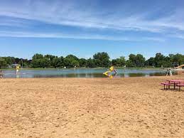 A photograph of a beach in Kimberly, Wisconsin. Kimberly, Wisconsin is a location served by Rosenow Customs.