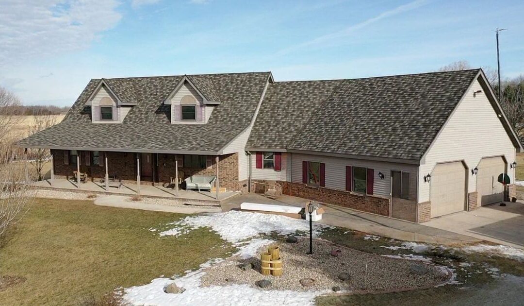 A Wisconsin home featuring DECRA Stone-Coated Metal Roofing, highlighting its durability and aesthetic appeal.